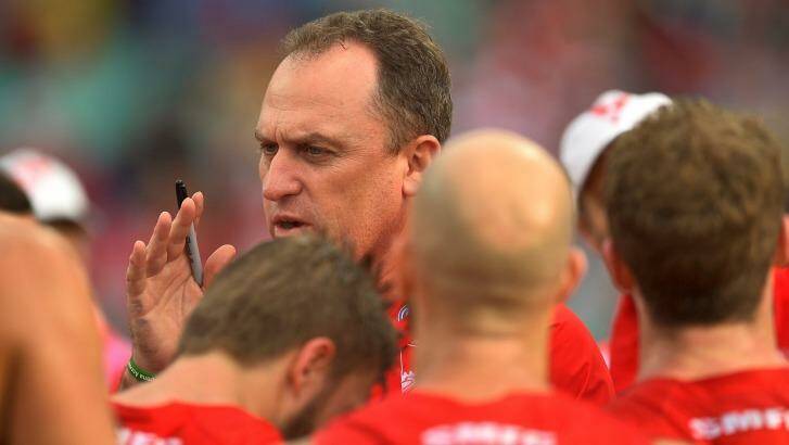 Swans coach John Longmire speaks to the players at half time during the round 20 match against Port Adelaide Power. Photo: Brett Hemmings/AFL Media