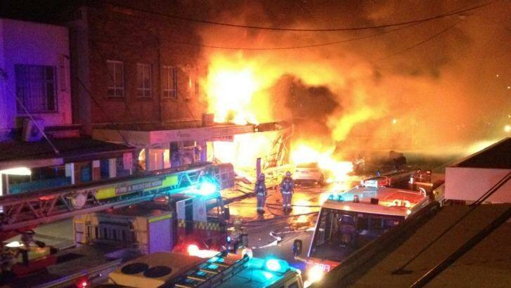 The fire destroys shops and apartments on Darling Street. Photo: Steven Davidson