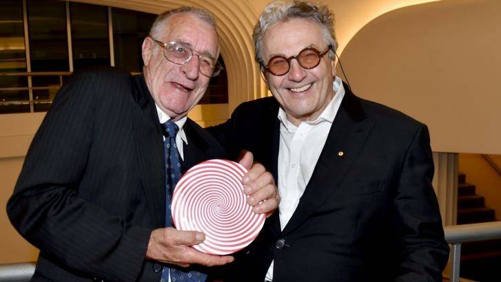 Stuntman Grant Page accepts his Screen NSW lifetime achievement award from director George Miller.  Photo: Steven Siewert