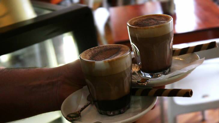 Taste test: Can pod machines compete with hot chocolates made at home or in cafes (above)? Photo: Janie Barrett