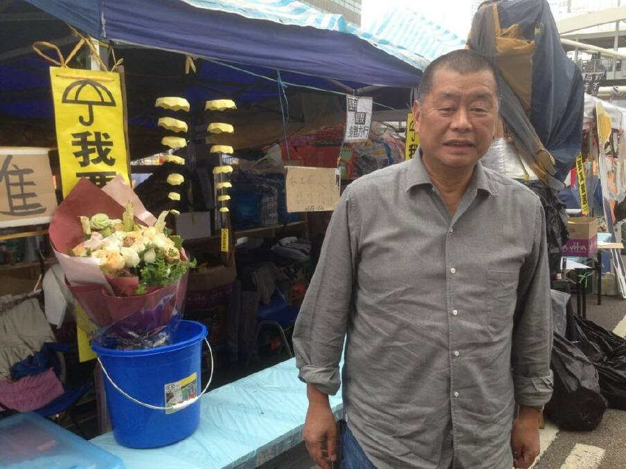 "I want genuine universal suffrage" reads the umbrella sign at Hong Kong Media magnate Jimmy Lai's tent.  Photo: Charmaine Chan