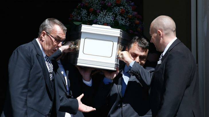 Mourners carry the coffin of the Rozelle blast victims Bianka and Jude O'Brien.  Photo: Daniel Munoz