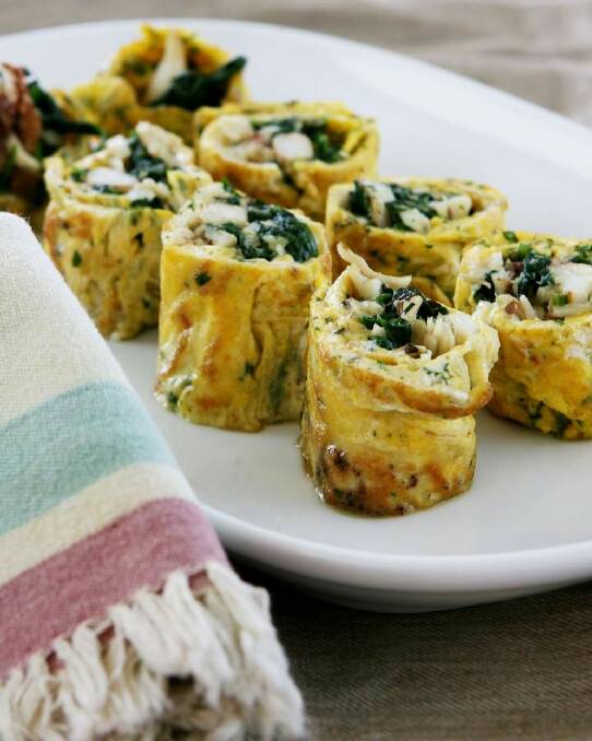 Crab and spinach frittata rolls <a href="http://www.goodfood.com.au/good-food/cook/recipe/crab-and-spinach-frittata-rolls-20121123-29x3l.html"><b>(RECIPE HERE).</b></a> Photo: Domino Postiglione