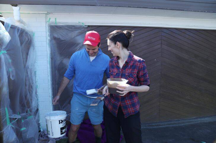 23-08-17 Fairfax Media Picture by David White  Labour Leader Jacinda Ardern and partner Clarke Gayford painting there front fence on election day Picture by David White Labour Leader Jacinda Ardern and partner Clarke Gayford spend the day painting their front fence on election day