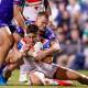 Zac Lomax is tackled during his five-star display in Dragons' thumping victory over the Warriors (David Neilson/AAP PHOTOS)
