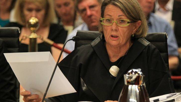 Ms Latham holds up the envelope containing the phone transcript. Photo: Peter Rae