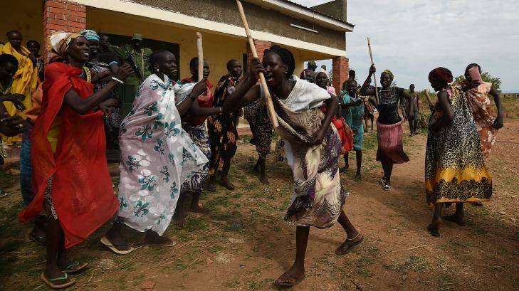 Supporters of the opposition dance on the outskirts of Juba. Photo: Kate Geraghty