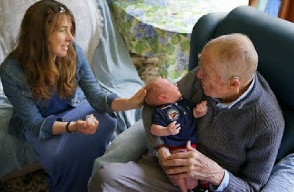 John Morison greets great grandson Will with granddaughter Jodie on his 90th birthday last year. Photo: Morison family
