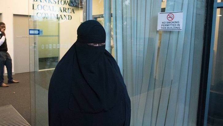 The mother of one of the 16-year-old boys leaves Bankstown police station on Wednesday evening. Photo: Christopher Pearce