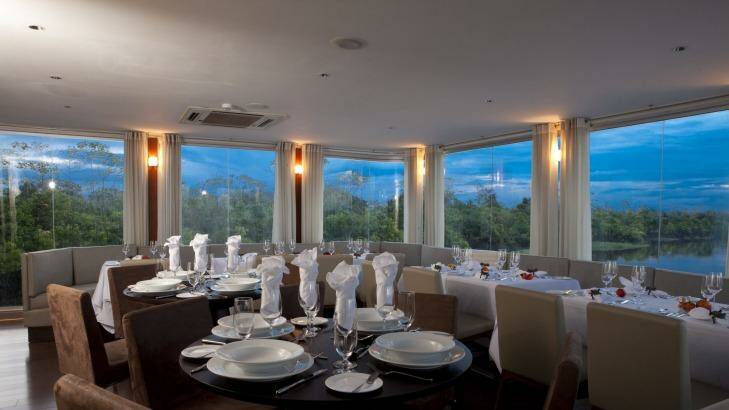 Meals by Pedro Miguel Schiaffino are served up in a dining room with a view. Photo: Aqua Expeditions