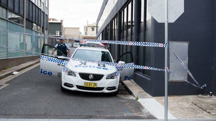 Police guard the laneway where the two boys were arrested on Wednesday. Photo: Christopher Pearce