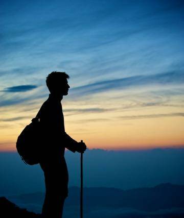 A hiker pauses at sunset on Mount Fuji, Japan. Photo: Jacob Jung