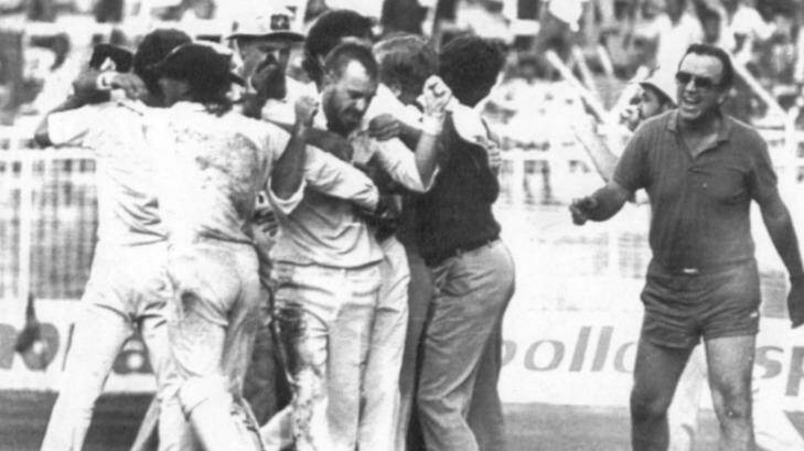 Thrilling finish: Bob Simpson, the only person to have participated in two tied Tests, runs onto the field to congratulate last-over hero Greg Matthews after he had Maninder Singh LBW and tied the 1986 Madras Test.  Photo: Vino John, Indian Express