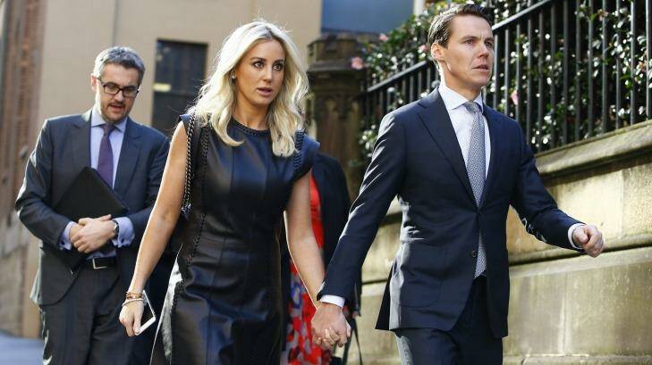 Oliver Curtis and wife Roxy Jacenko arrive at his insider trading trial on Friday. Photo: Daniel Munoz