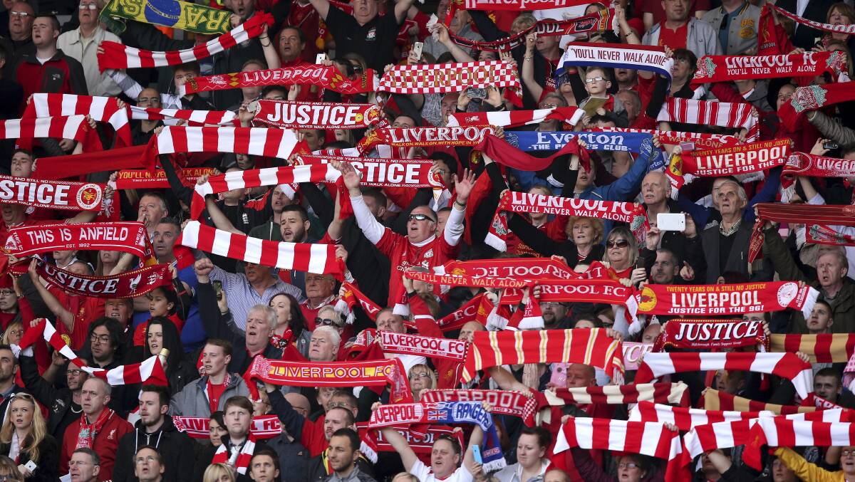 Fans sing Liverpool’s song You’ll Never Walk Alone at the 25th anniversary tribute game.
