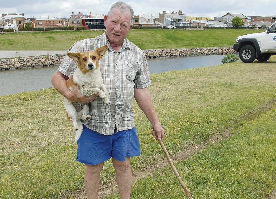 Grahme Jenkins with his dog Poochie was confronted by an eastern brown snake near the Hunter River at Lorn.