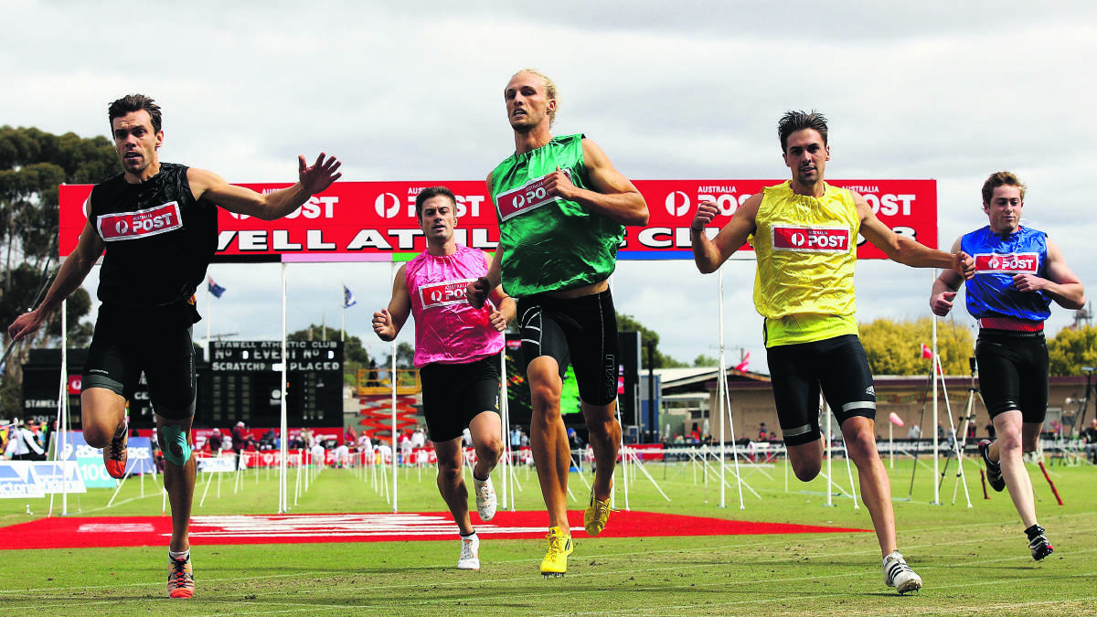 SEMI-FINAL: Tim Eschebach (in green) wins his semi-final at last year's Stawell Gift. He finished sixth in the final.