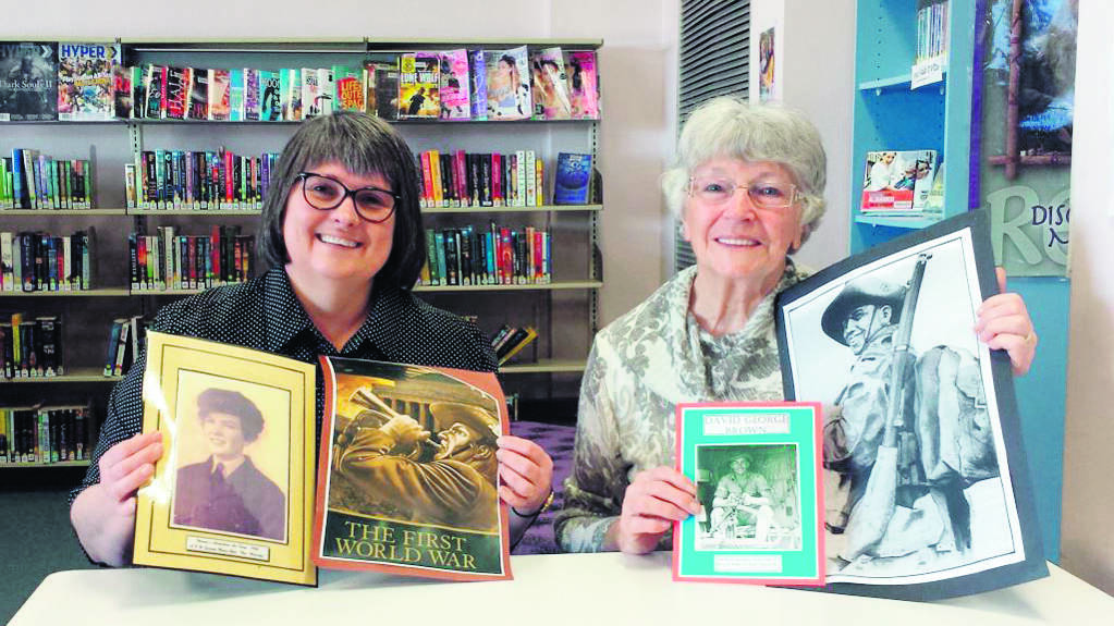 Kurri Kurri Library team leader Karen Bruce and Beth Masterman with some of the memorabilia.