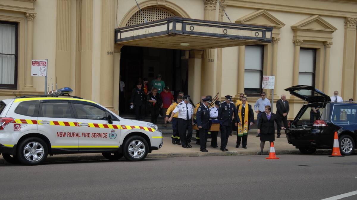 David Templeton's casket is taken from Maitland Town Hall where more than 500 people gathered to remember him.