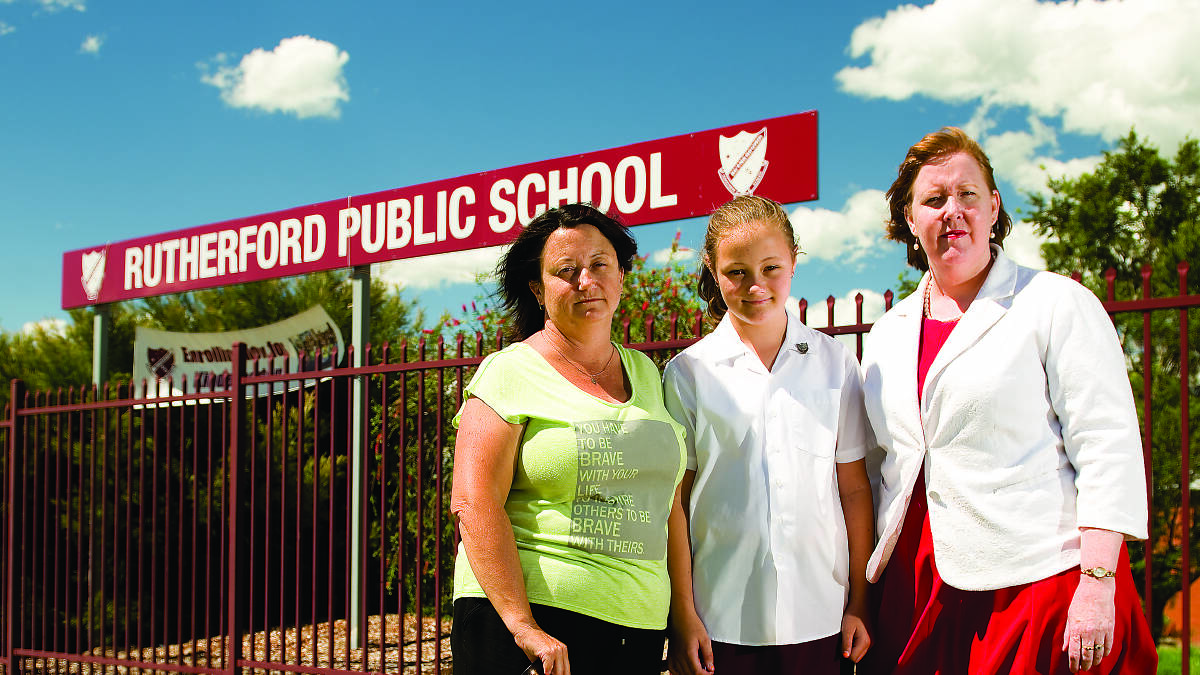 Rutherford Public School P&C president Rachael Henderson and her daughter Ella from year 6 with Labor candidate for Maitland Jenny Aitchison.