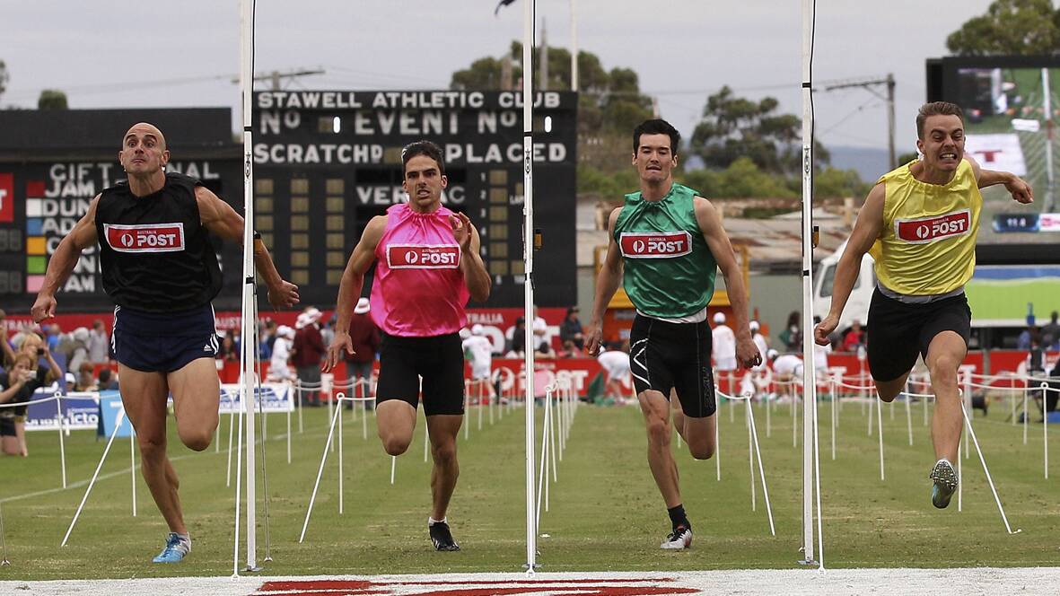  Victorian sprinter Luke Versace (left) crosses the line to win the Stawell Gift.