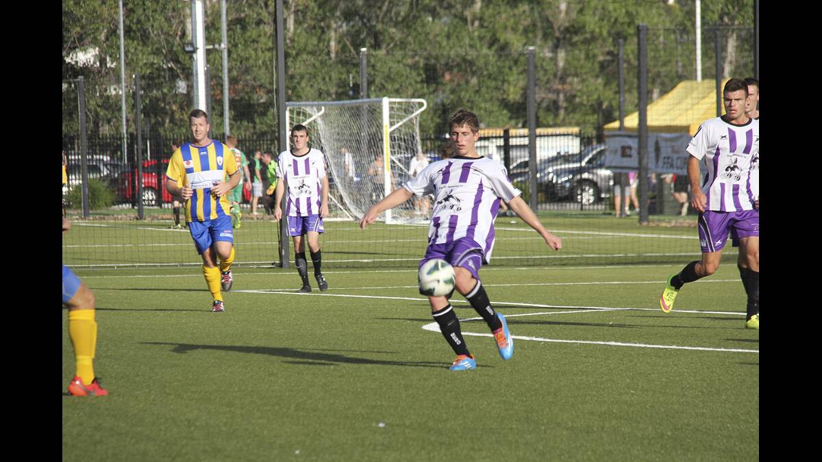 CLEARANCE:  Beresfield’s Cal Stammer transistions the ball forward during his teams 1-all draw with Toronto Awaba before a 4-2 penalty shootout victory.	Picture courtesy Northern NSW FOOTBALL
