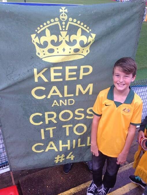 Matthew Hubbard’s son Oliver with the Keep Calm and Cross it To Cahill #4 sign at Tuesday night’s Asian Cup game.
