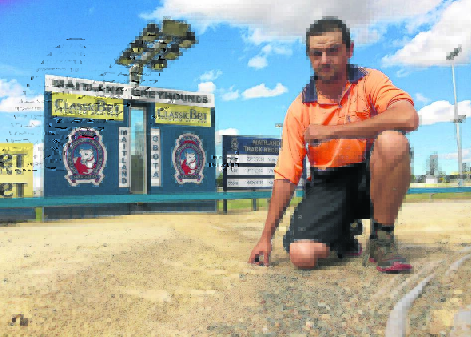 HUGE JOB:  Track groundsman Liam Baker surveys the damage to the Maitland Showground greyhound track.  The sand has been stripped back to the gravel base. 