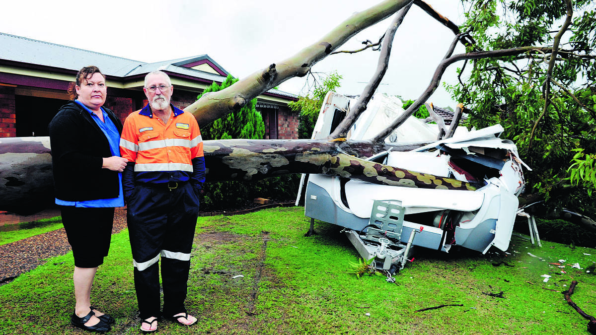 LUKY ESCAPE:  Their caravan is crushed but Debbie and Craig Cameron are thankful they and their home escaped the same fate.  	Picture by CATH BOWEN