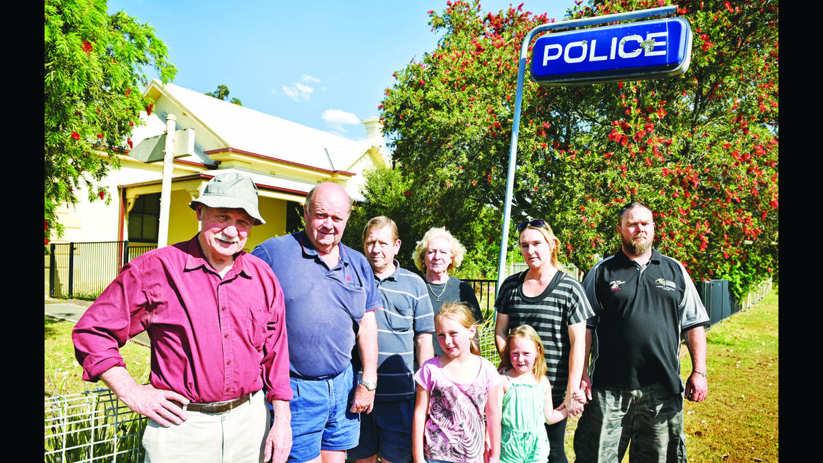 NEED FOR POLICE:  Some of the locals who turned out to prrotest the decision to sell off the local police station.   	Picture by PERRY DUFFIN
