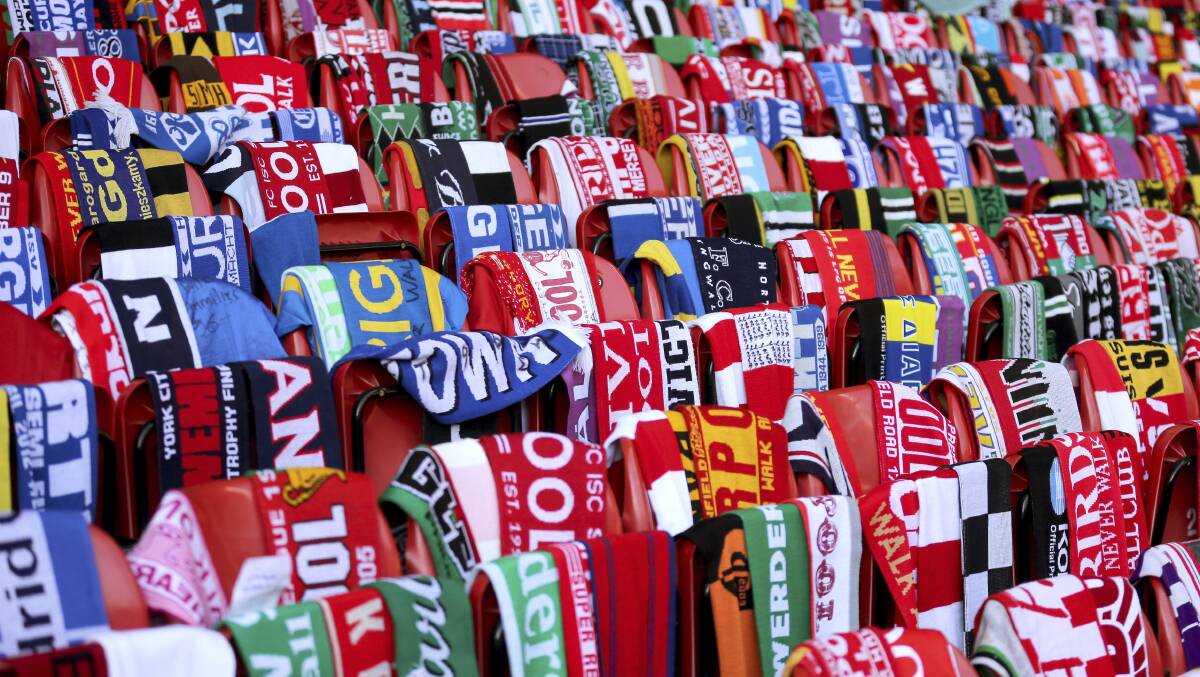 Scarves from across the world are laid in tribute to the 96 fans who lost their lives.
