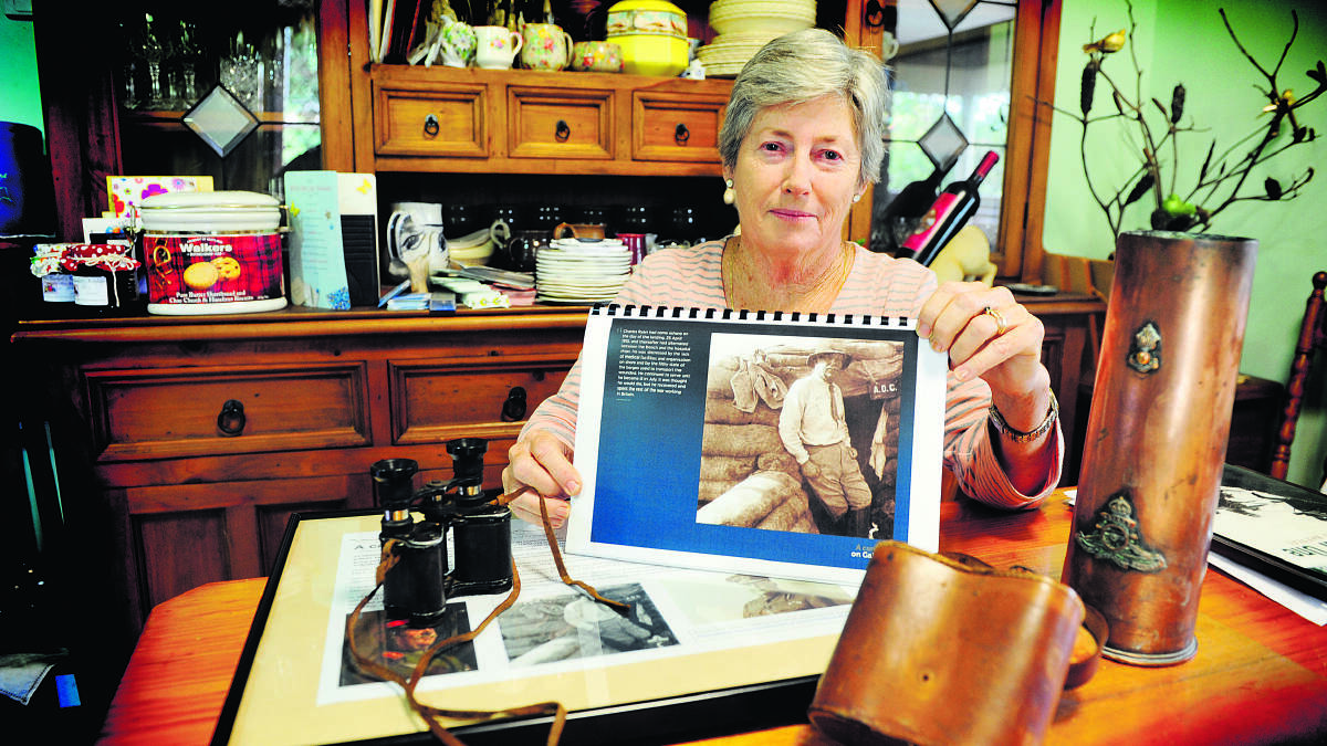 Maitland Regional Museum member Janece McDonald  with a picture of Sir Charles Ryan.