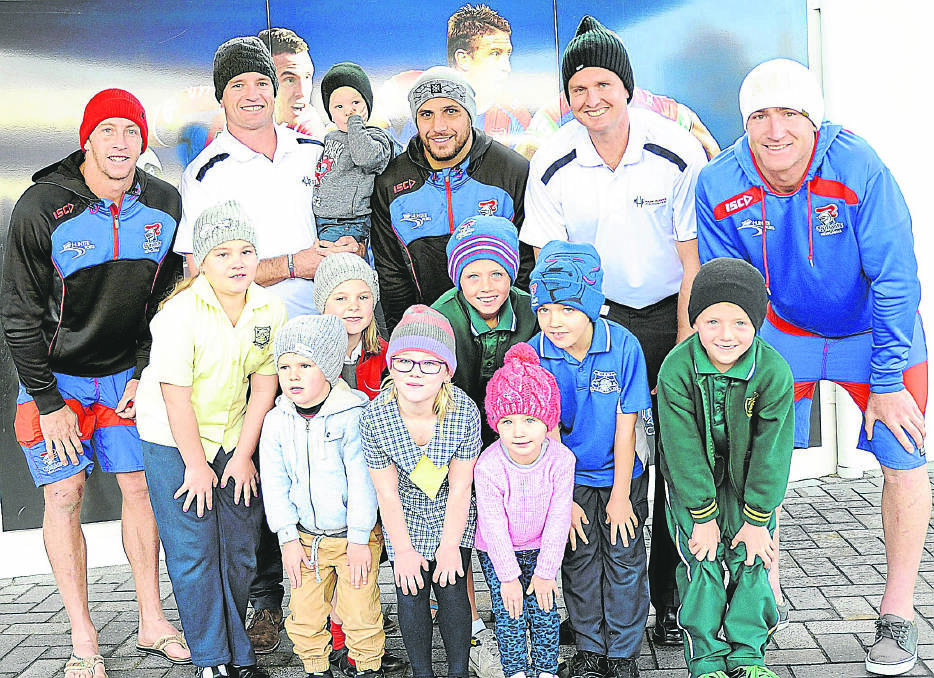  Knights players (rear) Kurt Gidley, Danny Buderus holding son Jack, Jeremy Smith, Mark Hughes and Chris Houston with fans (front) Sienna Macdonald, Lachie Buderus, Ella Buderus, Addison Macdonald, Zac Hughes, Bonnie Hughes, Ethan Martin and Dane Hughes.