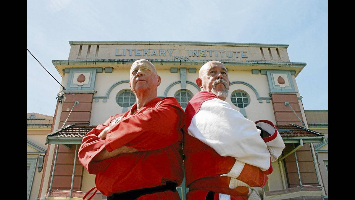 MAITLAND’S MIYAGI:  Neville Levine and Peter Kirkwood stand outside the building where it all started. Picture by JOSH CALLINAN