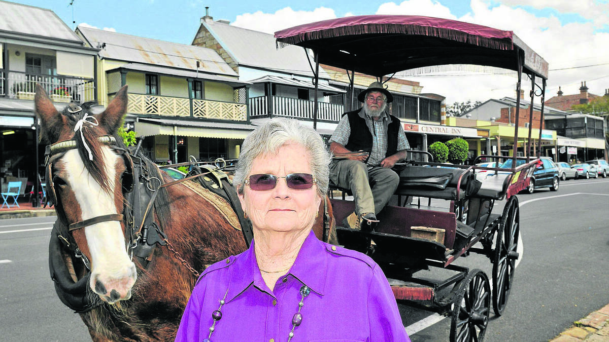 Roma Whybin of East Maitland took a trip into her family's past during a horse and carriage ride around Morpeth for her 80th birthday.