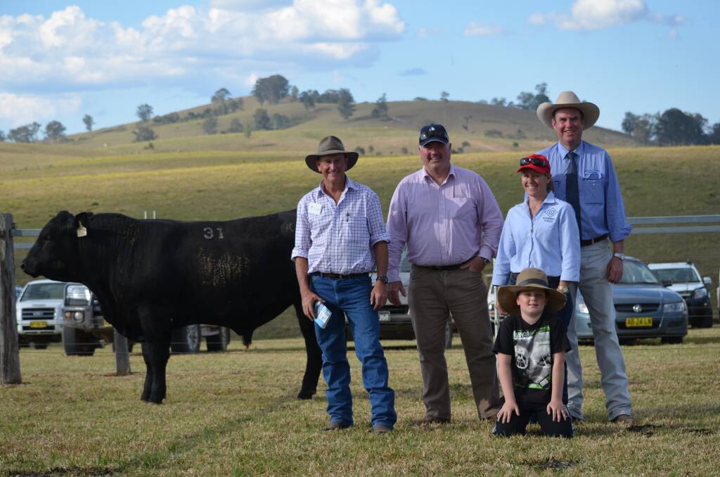 $18,000 KNOWLA KATICH K31 with Ted Laurie Knowla Livestock, Chris Watson, Alex Watson & Di Bignell Kimbriki Angus & auctioneer Paul Dooley