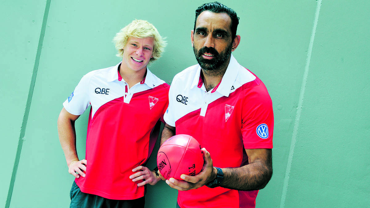 IN THE BLOOD:  Sydney Swans players Isaac Heeney and Adam Goodes dropped into Maitland ­yesterday.  	Picture by CATH BOWEN