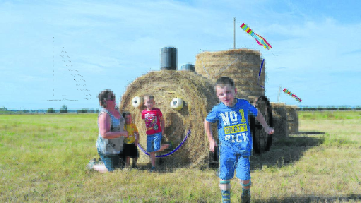 HAY, TAKE A LOOK:  Michelle Viola with sons Ethan, Andrew and James and their hay train.   	Picture JESSICA BROWN  