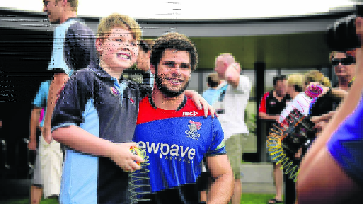 TRAINING RUN: Aspect Hunter School student Tom Amy caught up with Jake Mamo at the Newcastle Knights training sessions this week.  	Picture by PERRY DUFFIN 