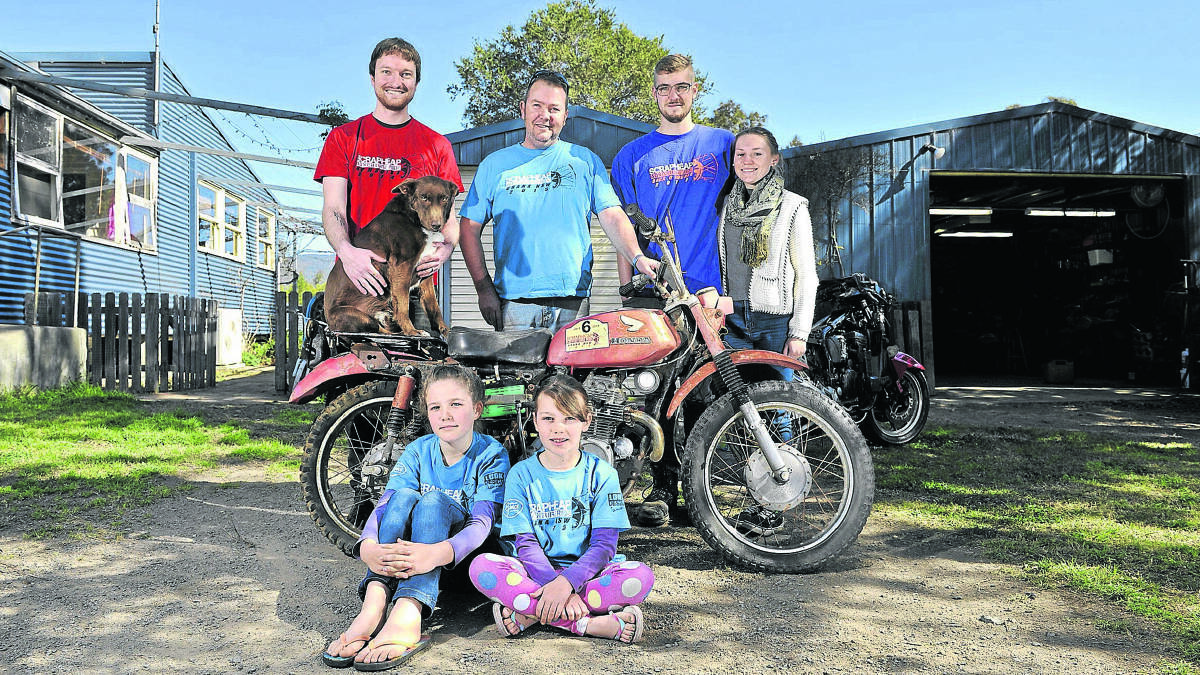 FOR CHARITY:  Luke Bennis, Joe Thompson, Ryan Thompson, Amy Easton, (front) Ursula and Lucy Thompson, and their dog Slim Pickens.  	Picture by PERRY DUFFIN