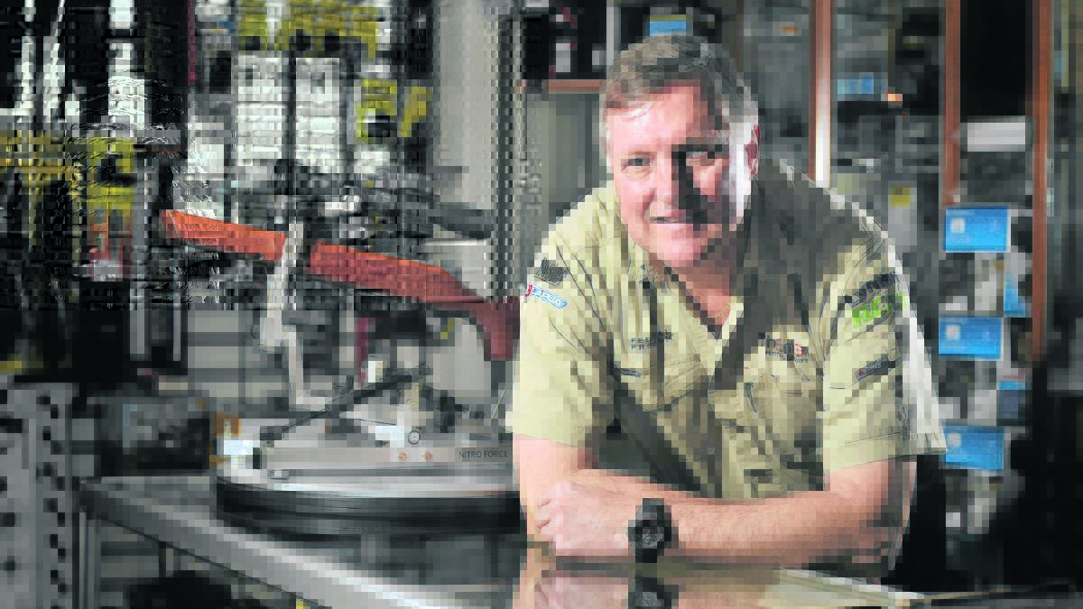 NOTHING TO WORRY ABOUT:  Licensed firearms dealer Chris Barrett puts the increase in gun sales down to the growing popularity of gun range sports.   	Picture by PERRY DUFFIN 