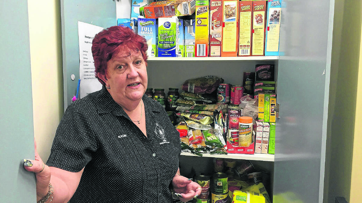TRYING TIME:  Maitland Neighbourhood Centre manager Naomi Rees says food donations are desperately needed.   	Picture by ALAN HARDIE
