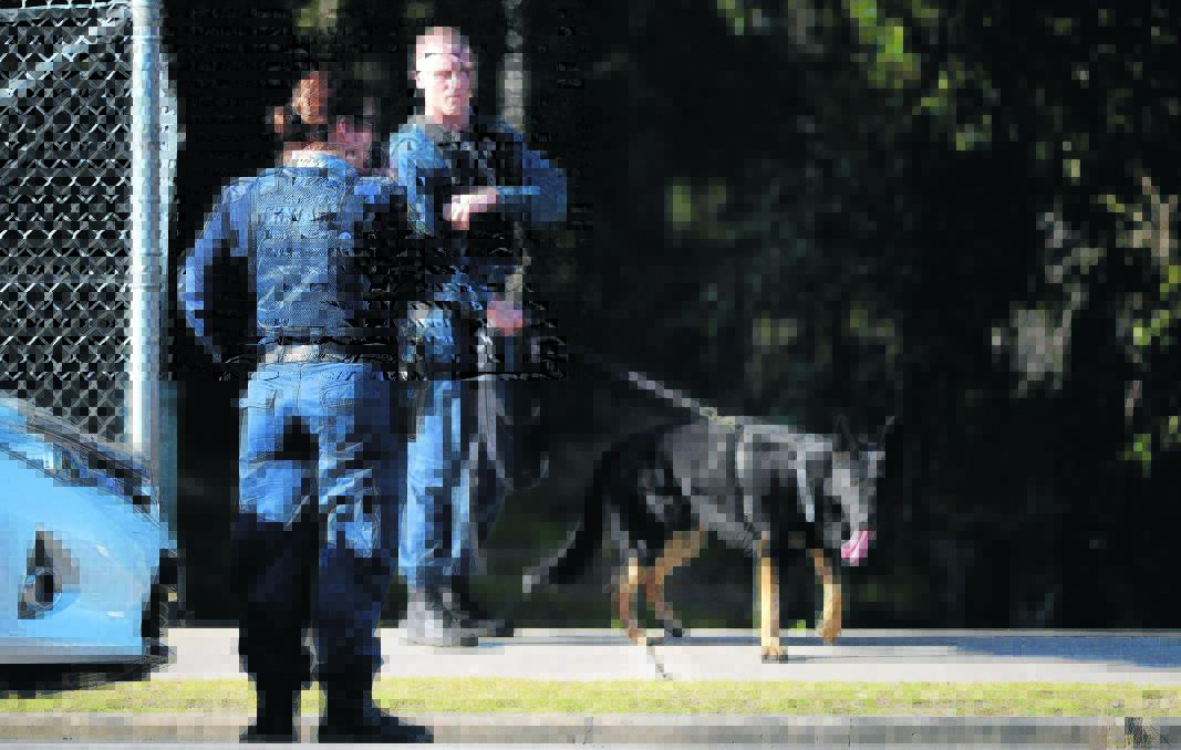 ARMED ROBBERY:  The dog squad was unsuccessful in tracking down the armed robber on Tuesday. 	