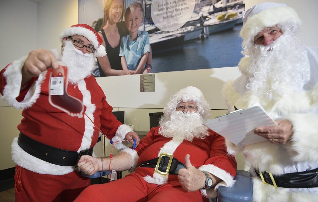 JOLLY GOOD FELLOWS:  Santas Gary, Jeff and Ted from the Maitland Community Men’s Shed rolled up their sleeves to donate blood ahead of the high-demand Christmas holiday period.   	Picture by PERRY DUFFIN 