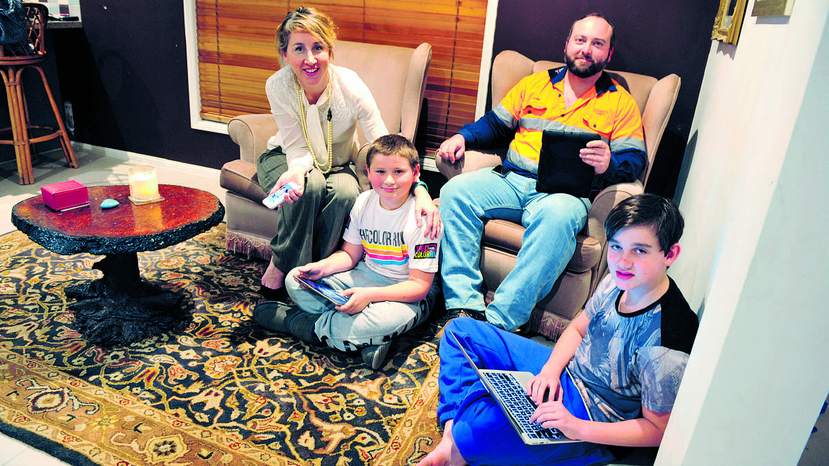 SCREEN TIME:  Stacey and Colin Pethers with their sons Willoughby and Henry. 	Picture by CATH BOWEN 