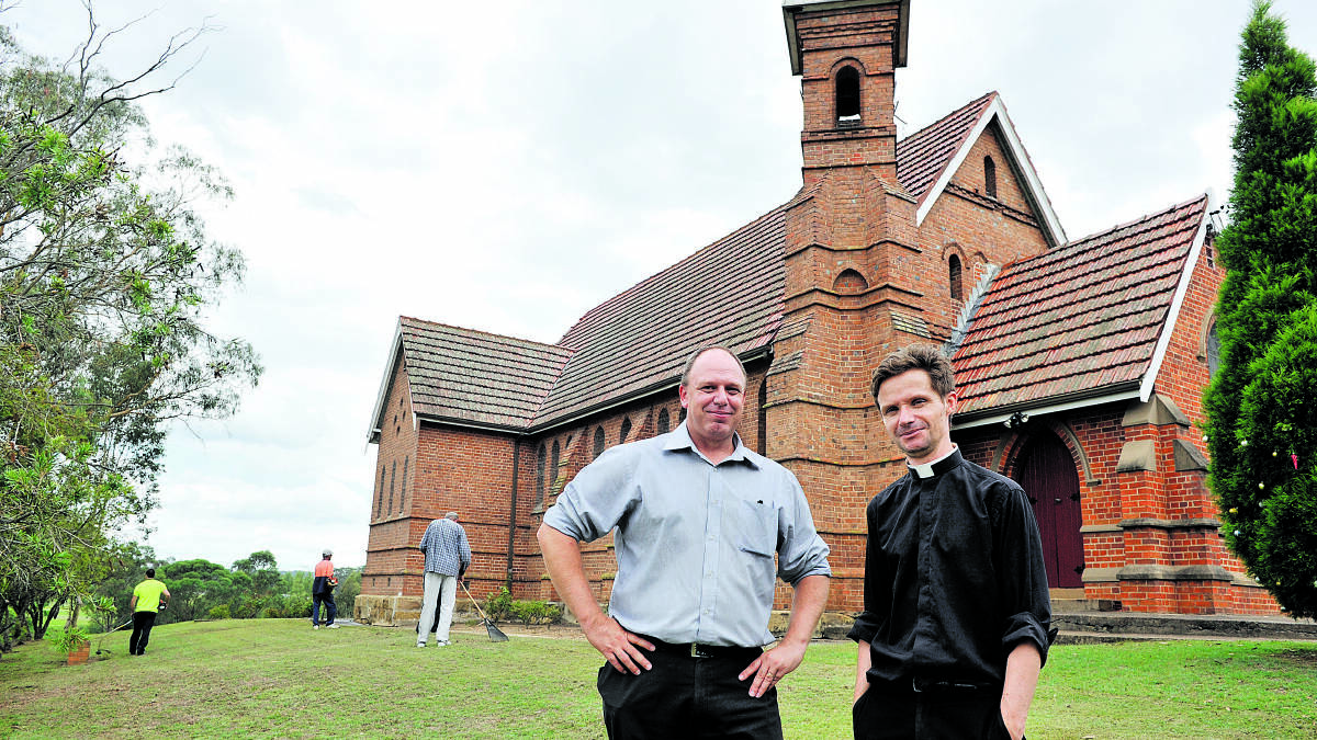 SENSE OF ACHIEVEMENT:  Community Corrections manager Daniel Wilson with Father Chris Orczy at  St John’s Church, Branxton. 	Picture by CATH BOWEN 