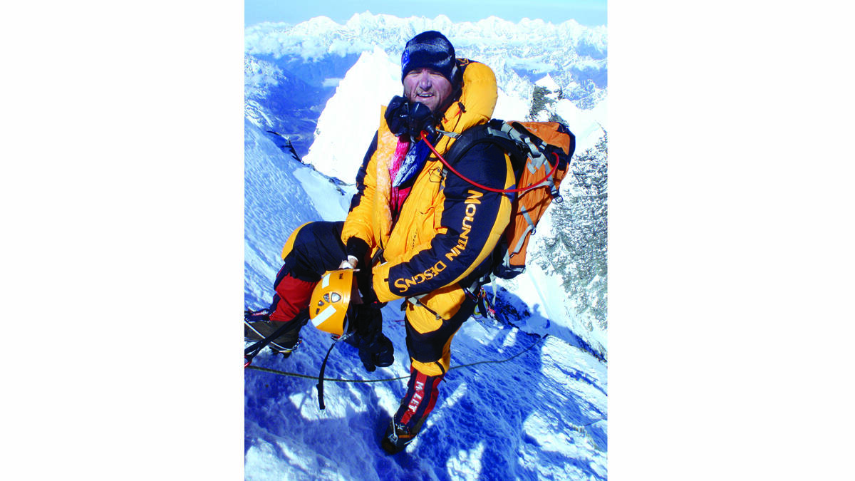 FUND-RAISER:  Gavin Vickers at the summit of Mount Everest. The experienced mountaineer is raising money to help the people of Nepal and to put a halt to child trafficking. 