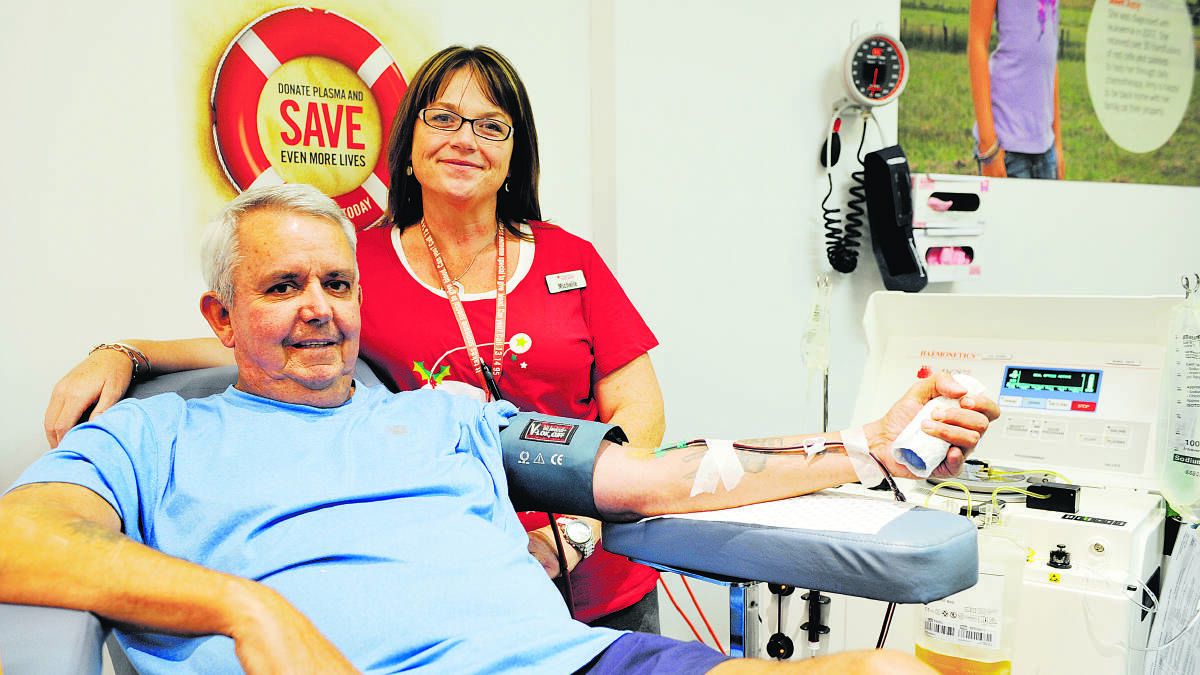 DONORS NEEDED:  David Brooks of Kurri Kurri gives plasma for the first time with the help of Maitland Blood Bank session leader Michelle Short.	Picture by CATH BOWEN