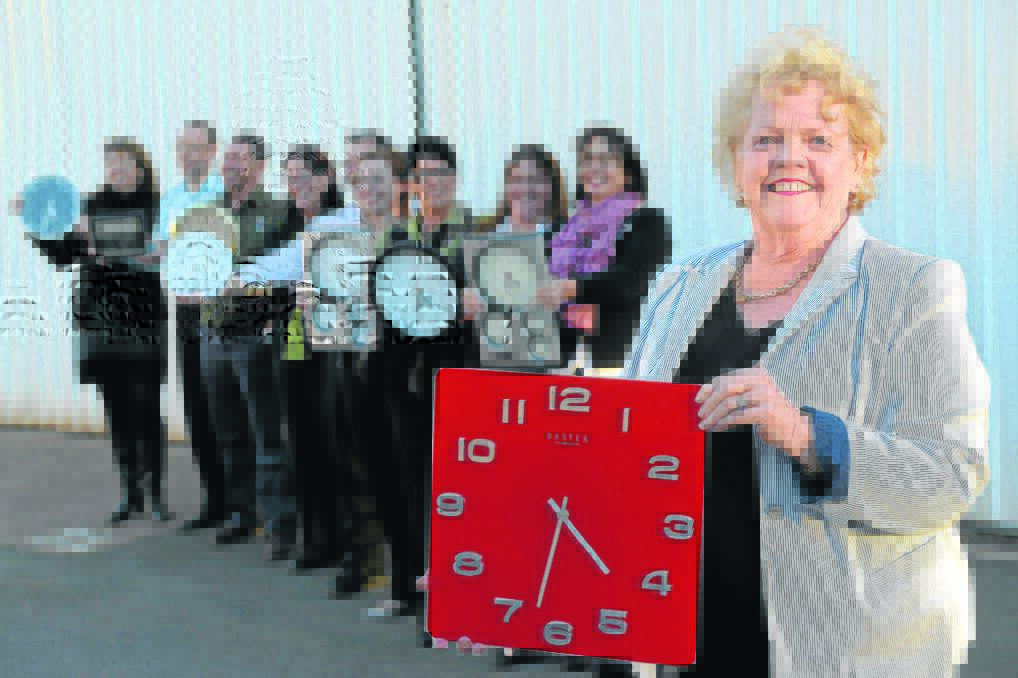 DIFFERENT TIMES:  Mai-Wel CEO Pennie Kearney and her team with 10 clocks to signify the 10 years of time that is central to this year’s debate.