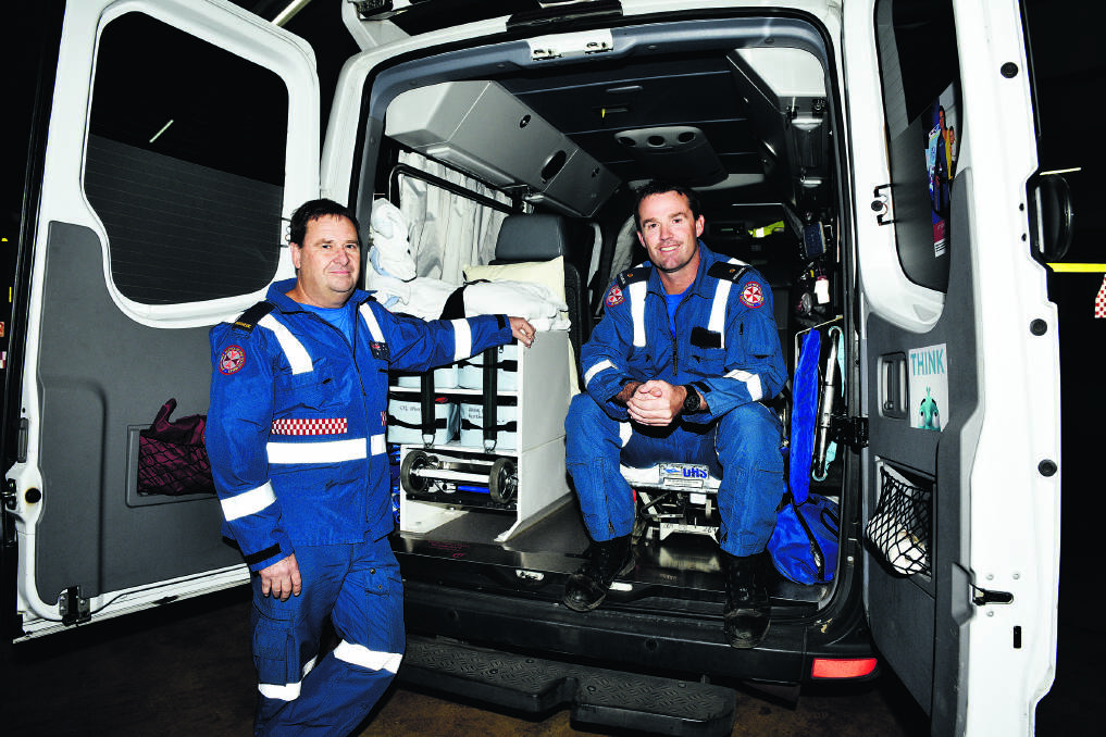 ON THE SCENE:  Rescue ­paramedics Bob Hiles and Scott Brent, who were quick to the scene of a burning house in time to ­resuscitate a beloved pet dog, Ditch.